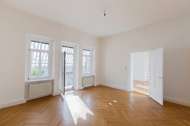 A white boxed home is for sale.