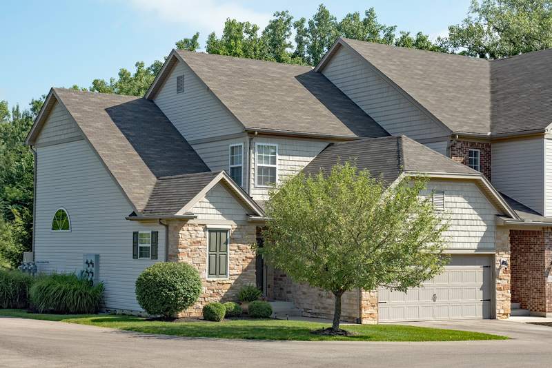 A townhouse condo on a corner lot.