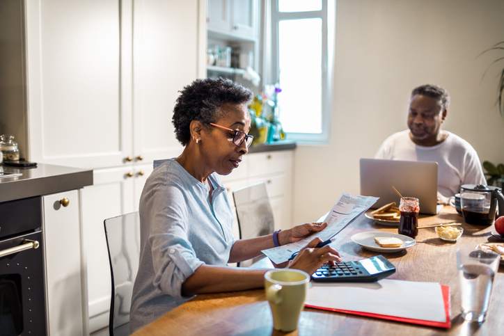 Close up of a senior couple going over their home finances