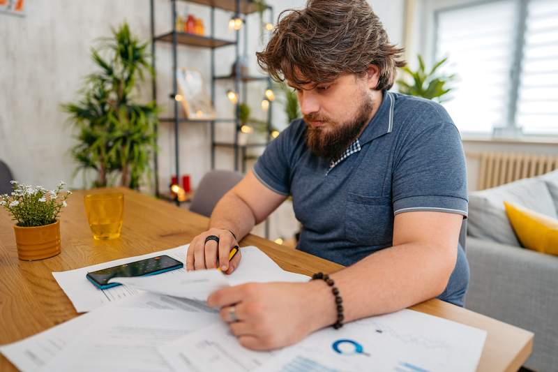 Man verifies his finances to obtain a proof of funds letter.