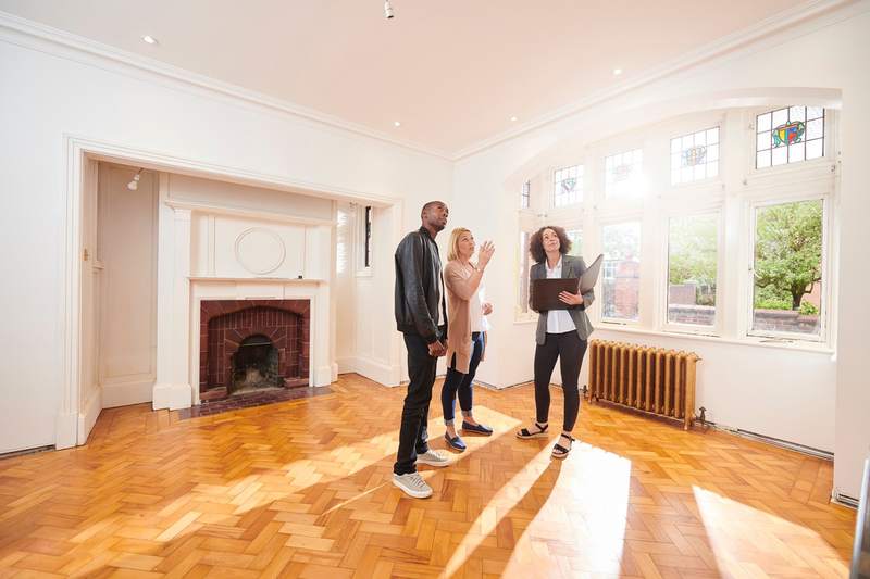 Surprised couple buying a house with a real estate agent